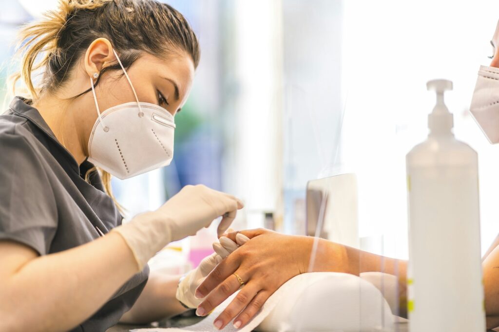 Pedicure treatment, blonde worker from the manicure and pedicure salon